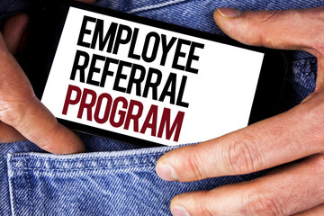 Word writing text Employee Referral Program. Business concept for Recommend right jobseeker share vacant job post written on Mobile phone holding by man on the Jeans background.