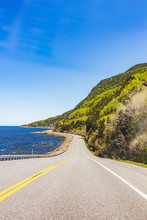 Coast Of Gaspesie Region Of Quebec, Canada With Road, Cliffs And Saint Lawrence River Ocean Rocky Landscape