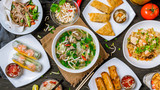 Fototapeta  - Assorted asian dinner, vietnamese food. Pho ga, pho bo, noodles, spring rolls
