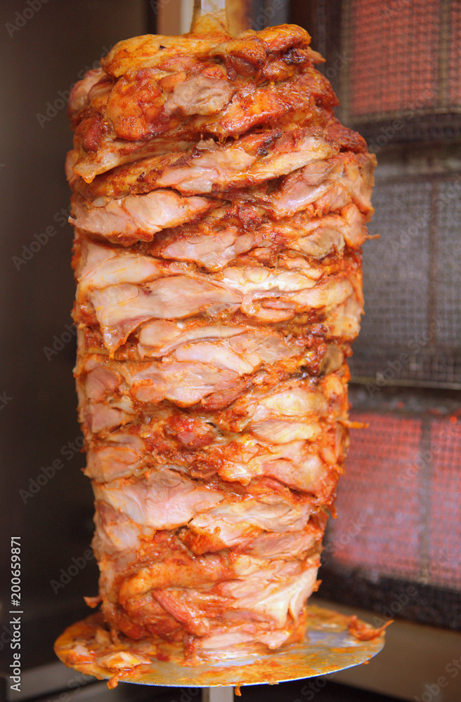 Saftiger Dönerspieß auf dem Drehgrill Stock Photo | Adobe Stock