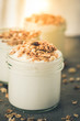© bramthestocker - Yoghurt with granola made of oats, raisins, puffed rice, chocolate and dried bananas. Healthy breakfast for family.