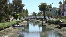 Boats In The Canal At Venice Canals In California During Low Tide