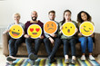 © Rawpixel.com - Group of diverse people holding emoticon icons