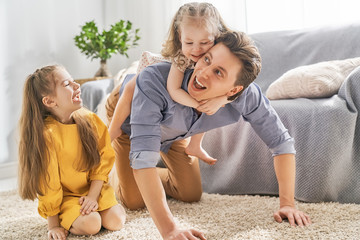 Wall Mural - Daddy and his children playing