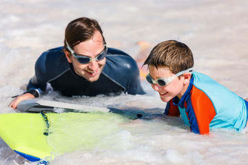 Canvas Print - Father and son boogie boarding