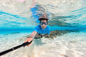 Wall Mural - Man swimming underwater