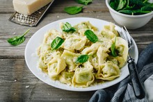 Italian Ravioli Pasta With Spinach And Ricotta On Wooden Background