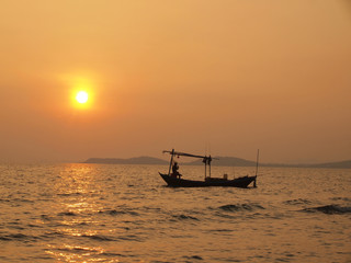 Wall Mural - Beautiful sunset over the sea and Fishing boat