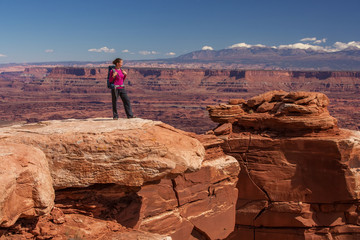 Poster - Hiker rests in Canyonlands National park in Utah, USA