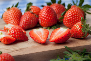 Strawberries on a wooden chopping board