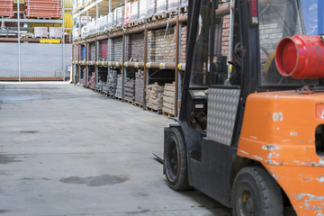 Wall Mural - forklift in a construction shop. Construction Materials