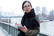 © nenetus - Beautiful asian young woman using her digital tablet in front of Seine river in Paris.