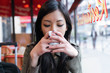 © nenetus - Beautiful young asian woman drinking coffee in the terrace of a coffee shop.