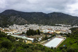Fototapeta Tęcza - nice white town Ubrique in Andalusia, Spain with its white houses, clouds and mountains