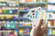 © onephoto - health care  holding at drugstore Pack birth control pills pharmacy drugstore
