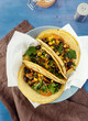 Top view vegetarian healthy corn tortillas with vegetables on wooden table