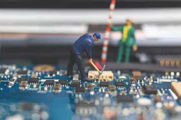 Wall Mural - Miniature people : Worker team of engineers repairing keyboard computer laptop