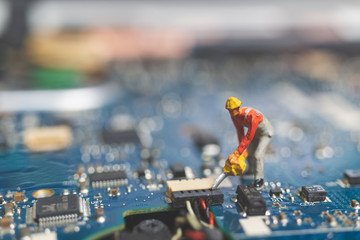 Wall Mural - Miniature people : Worker team of engineers repairing keyboard computer laptop