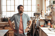 © mavoimages - Smiling young woodworker dreaming up new designs in his workshop