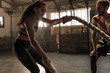 © Jacob Lund - Strong woman workout with battle ropes