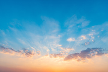 Wall Mural - beautiful dramatic sunset sky with orange and blue colored clouds.
