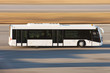 © aapsky - Modern transport bus on asphalt rides at high speed.