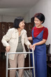 © toa555 - Elderly asian woman using a walker at home with daughter take care