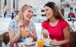 © bobex73 - Friends meeting in a cafe. Young women drinking coffee and enjoying in conversation. Consumerism, lifestyle concept