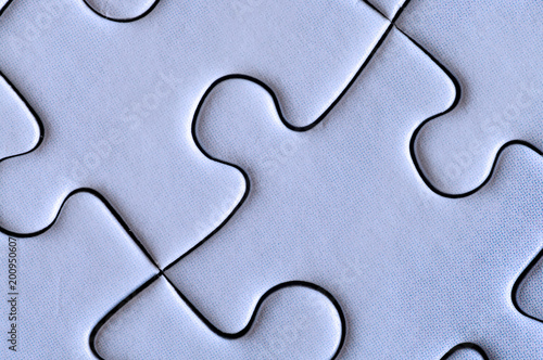 Fotografie, Tablou Connected pieces of puzzle. Closeup.