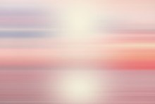 Peaceful Abstract Blur Beautiful Purple Ocean With Pink Sky Sun Background.
