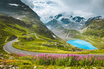 Alpine mountain scenery with country road in summer