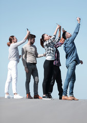 Wall Mural - rear view. happy friends doing a selfie.