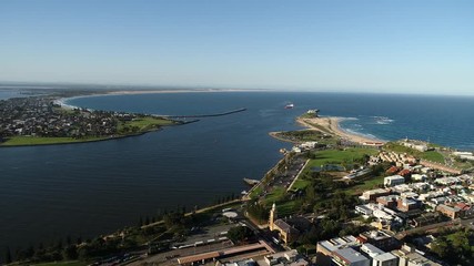 Sticker - Nobbys head, beach and lighthouse at the mouth of Hunter valley at Pacific ocean entrance – port of Newcastle city in Australia.
