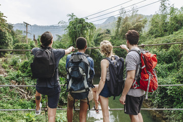 Wall Mural - Group of young adult friends outdoors recreational leisure, freedom and adventure concept