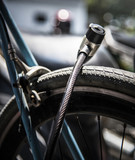 Fototapeta  - Metal lock on a bicycle wheel