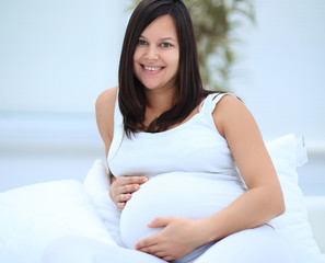 Wall Mural - portrait of a happy pregnant woman.