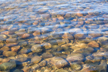 Crystal Clear Water Of Northern Lake With Stones On The Bottom