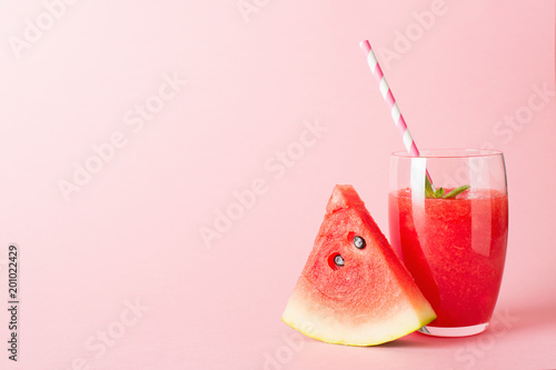 Fotografía Watermelon smoothie with slice of fruit and leaf of mint