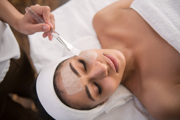 professional facial care. pleasant young woman doing a beauty procedure while visiting a beauty salo