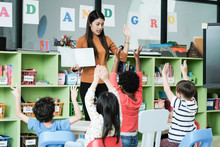 Young Asian Woman Teacher Teaching Kids In Kindergarten Classroom, Preschool Education Concept