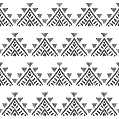 Wall Mural - Ethnic seamless pattern for modern home decor. Tribal graphic design. Textured geometric shape in a clean black and white palette.