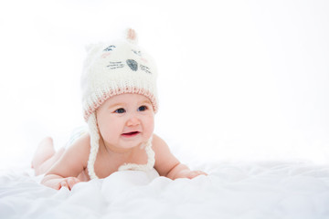 Adorable little baby girl smiling on white background

