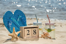 Mojito, Sneakers On The Beach With A Calendar On September 28, The International Sea Day