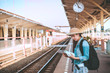 © reewungjunerr - Asian tourist wait train at train station,thailand hipster man go to travel