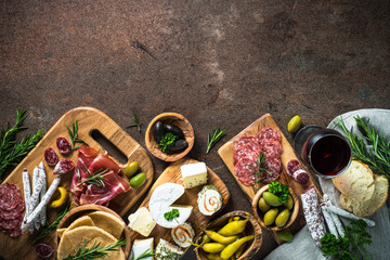 Sticker - Antipasto delicatessen - meat, cheese, olives and wine on stone 