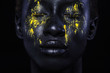© Mike Orlov - Cheerful young african woman with art fashion makeup. An amazing woman with black makeup and leaking yellow paint