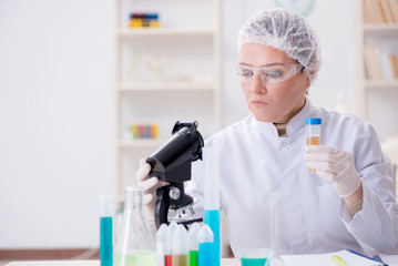 Doctor with test tube in medical hospital lab