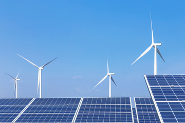 Wall Mural - rows array of polycrystalline silicon solar panels and wind turbines generating electricity in hybri