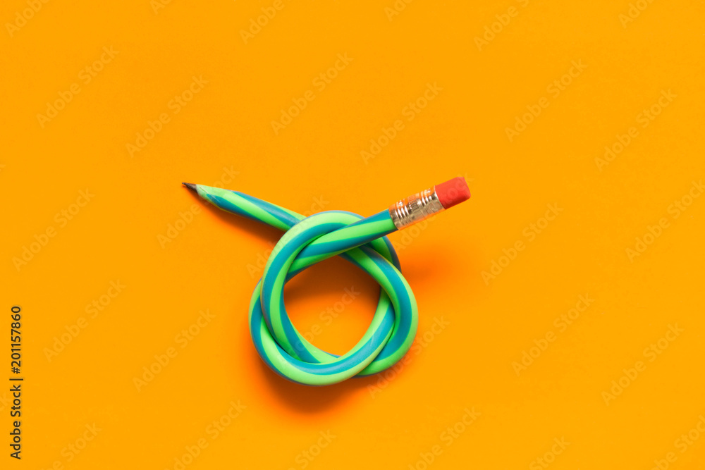  Flexible pencil . Isolated on orange background