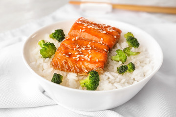 Wall Mural - Fish fillet served with rice and broccoli on white fabric